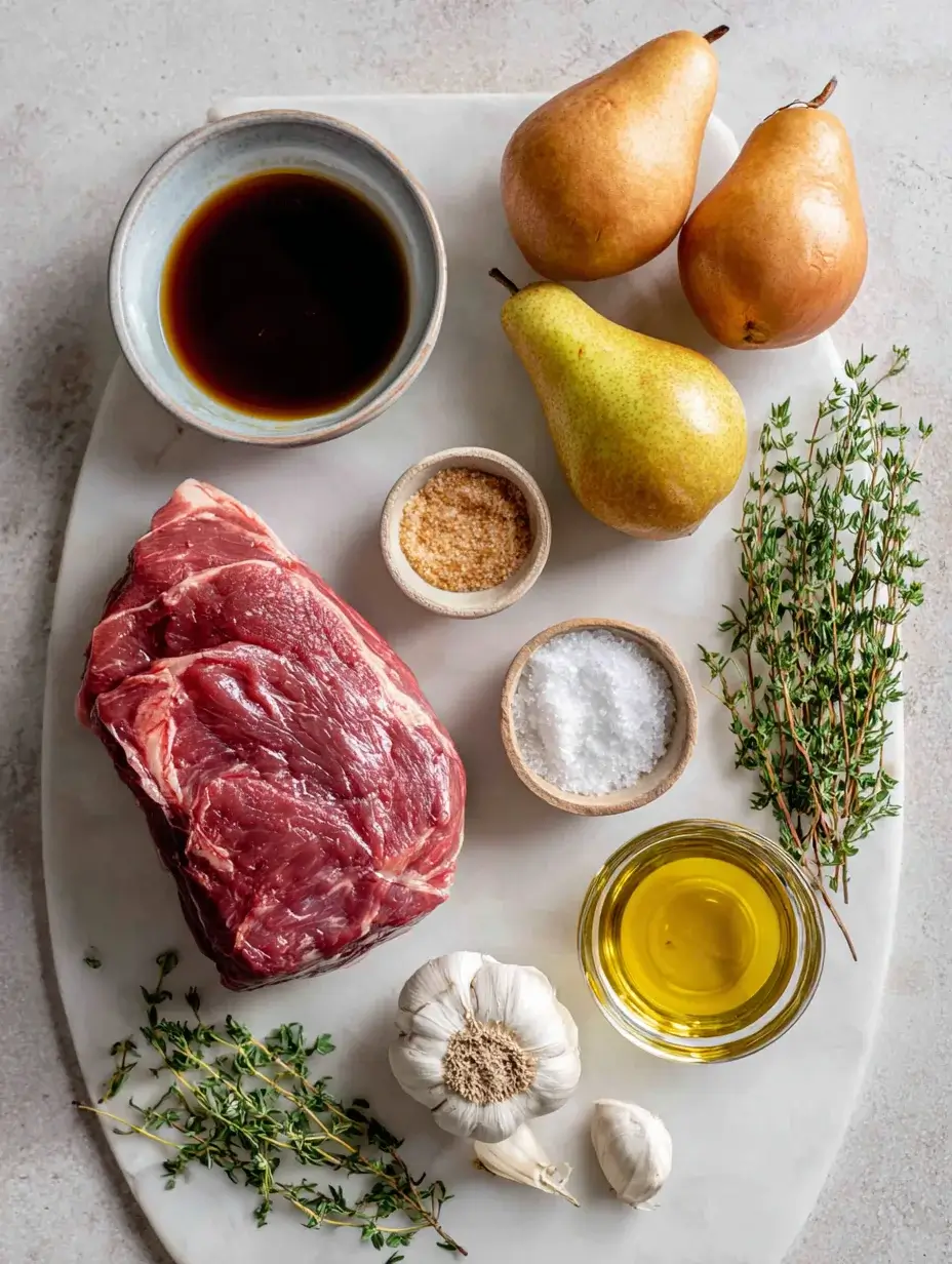 Ingredients for Maple-Balsamic Pulled Beef arranged on marble surface.