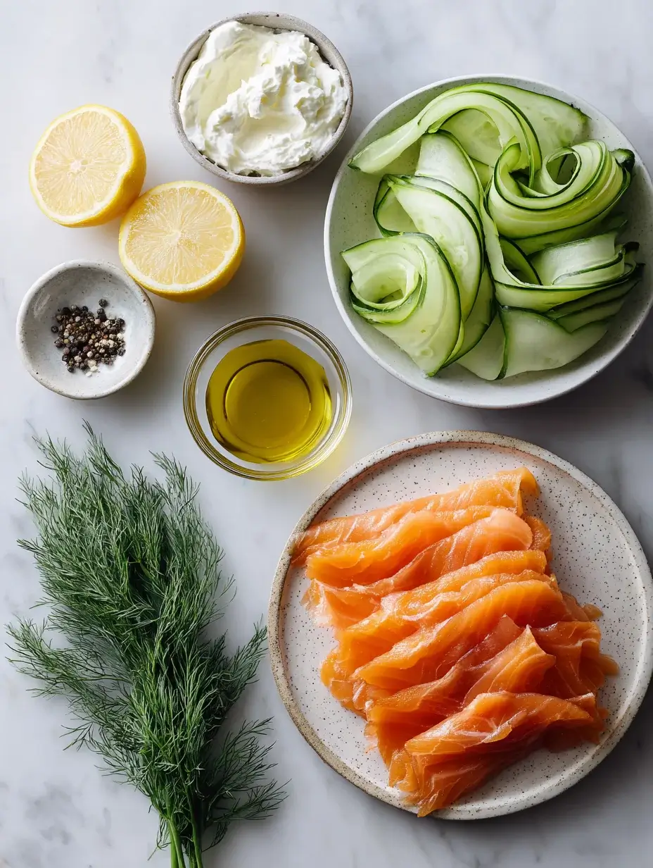 Fresh ingredients for smoked salmon rose recipe arranged on marble.