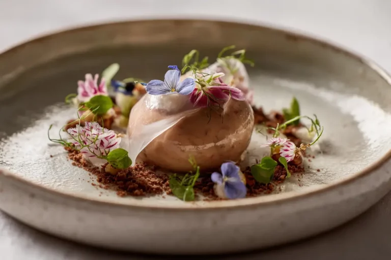 Duck rillette dome with fig veil and edible flowers